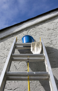 Painting Materials on Ladder Against Home Wall